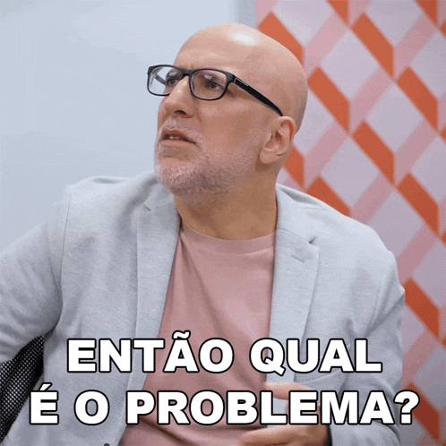 a bald man wearing glasses and a pink shirt says " então qual e o problema "