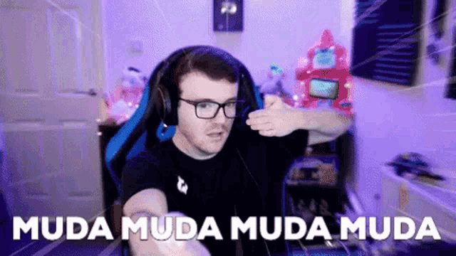 a man wearing glasses and headphones says " muda muda muda muda "