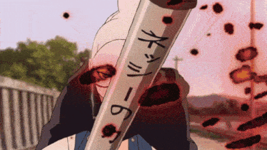 a person is holding a bloody stick with the number 9 on it