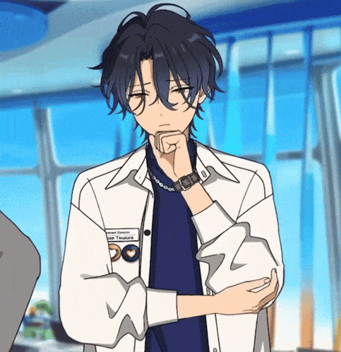 a man wearing a watch and a shirt that says ' louis yamaguchi ' on it