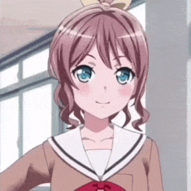 a girl with pink hair and blue eyes is smiling