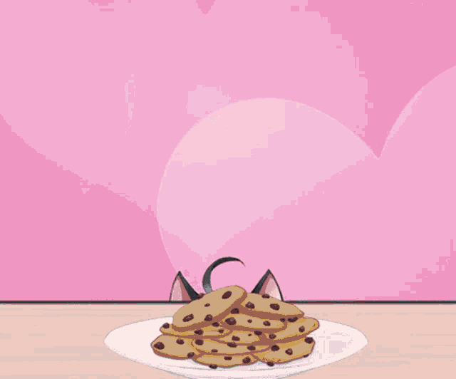 a cat girl with a bell around her neck is looking at a plate of cookies