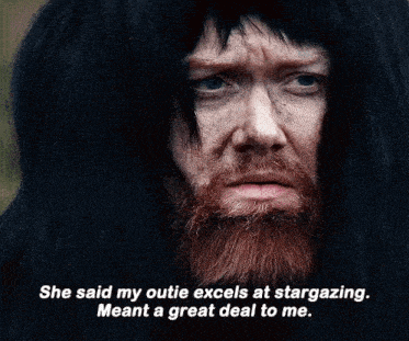 a man with a beard and long hair says she said my outie excels at stargazing