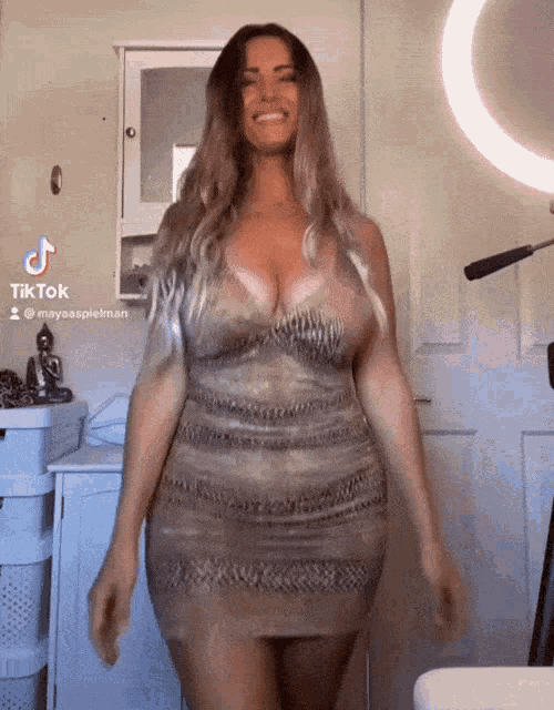 a woman in a dress with a tiktok watermark