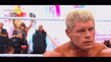a man in a wrestling ring with the hashtag # undisputed title on the bottom