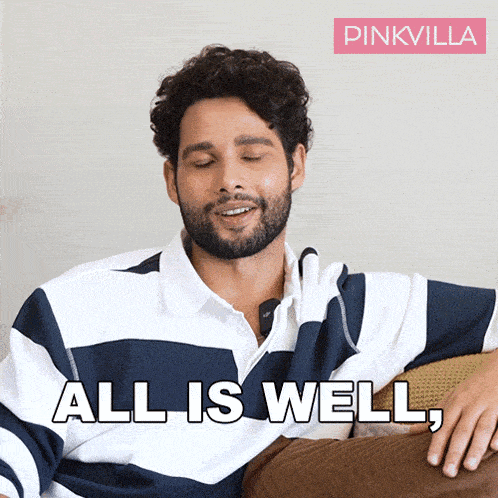 a man is sitting on a couch with his eyes closed and the words all is well behind him