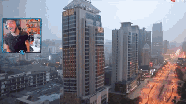 a man stands in front of a large building that says ' avengers ' on it