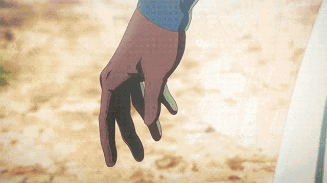 a person 's hand is reaching out towards another person 's hand