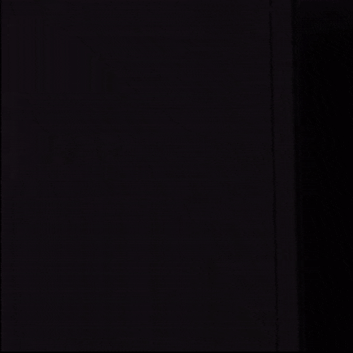 a roblox character with a blue shirt and green pants is standing in the dark .