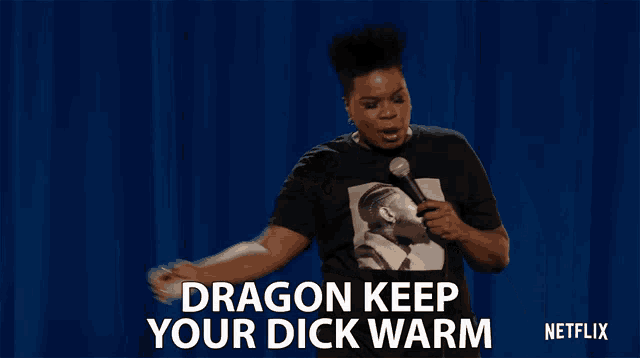a woman wearing a black shirt that says dragon keep your dick warm on it