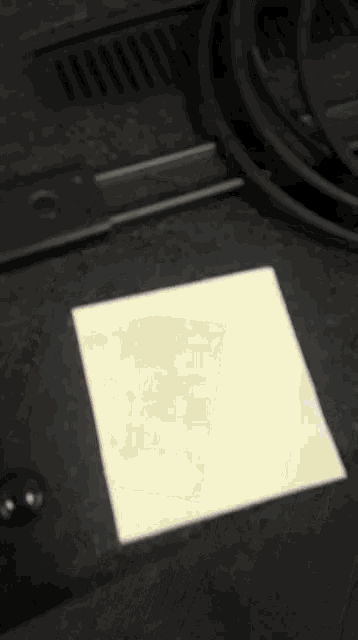 a blurred image of a stack of boxes with a red and white logo