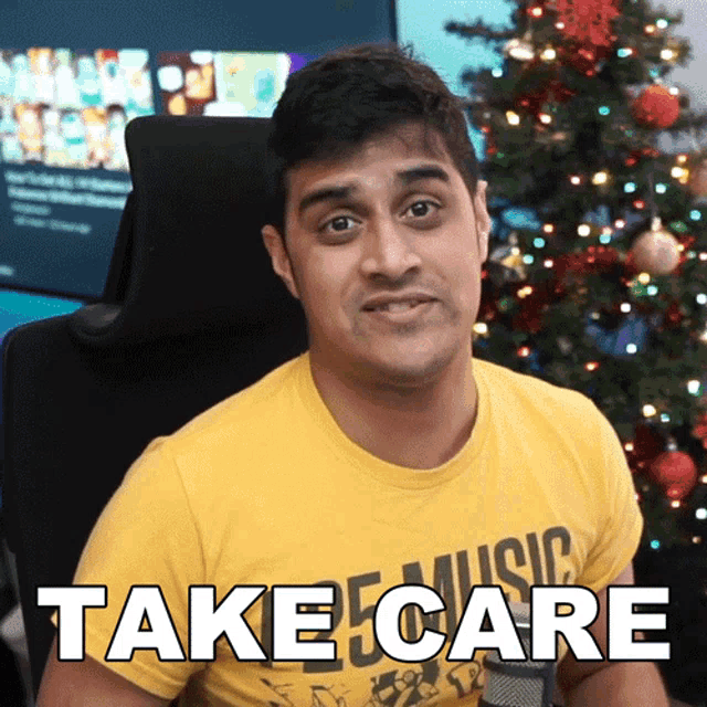 a man wearing a yellow shirt that says music on it says take care