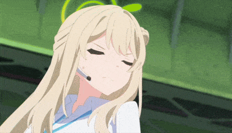 a blonde anime girl wearing a headset and making a funny face
