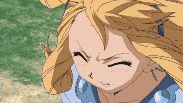 a close up of a girl 's face with a cross on her neck