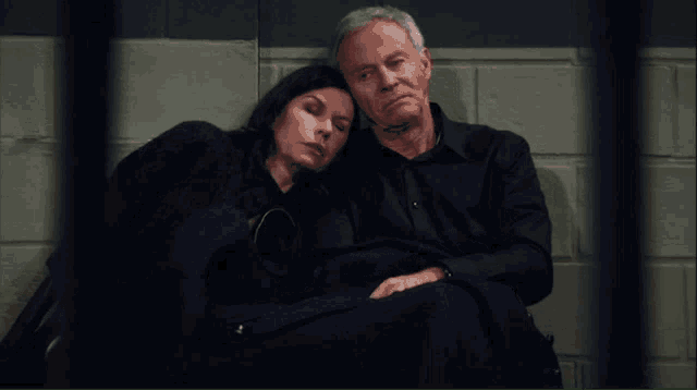 a man and a woman sitting next to each other