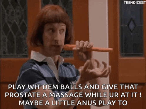 a man with red hair is holding a carrot in his mouth and says play wit dem balls and give that prostate a massage