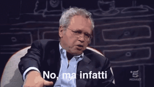 a man sitting in a chair with the words no ma infatti on the screen