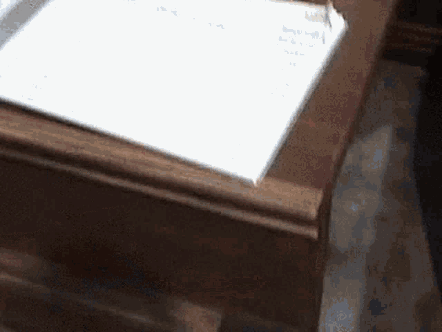 a wooden table with a piece of paper on it .