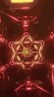 a kaleidoscope of red and blue lights with a heart in the middle .