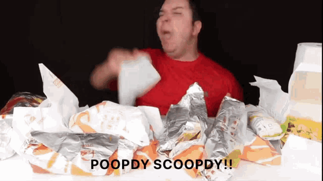 a man is sitting at a table with a bunch of food and the words poopdy scoopdy on the bottom