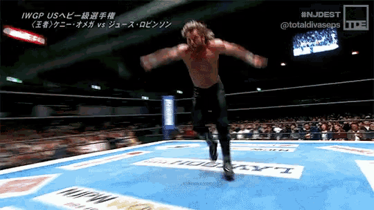 a man in a wrestling ring with the hashtag #njdest at the bottom