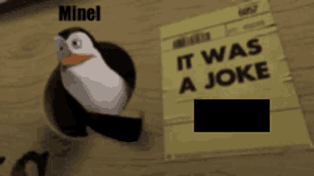 a penguin standing next to a piece of paper that says it was a joke