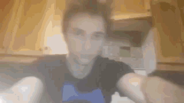 a blurry picture of a man taking a selfie