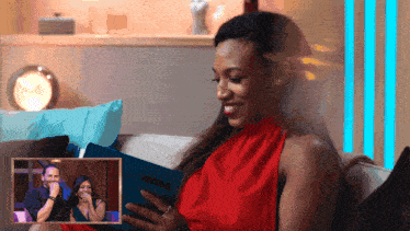 a woman sits on a couch reading a book called neoze