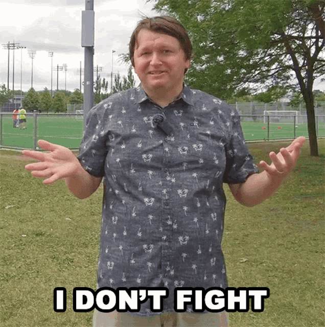 a man in a blue shirt says " i don t fight "