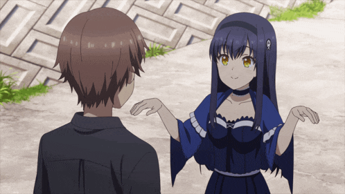 a boy and a girl are standing next to each other and the girl is wearing a blue dress