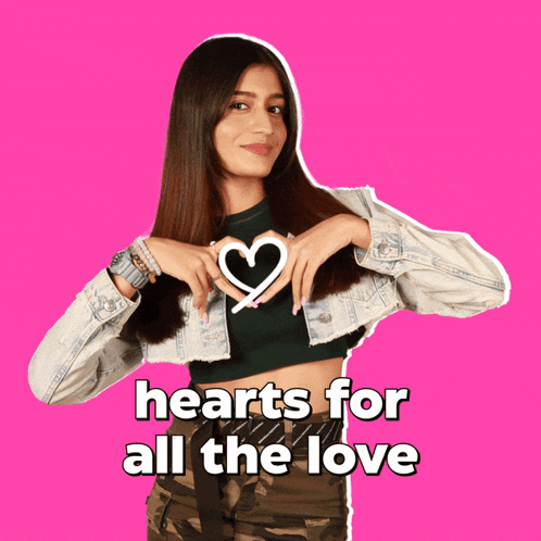 a woman making a heart shape with her hands and the words hearts for all the love