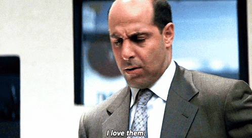 a man in a suit and tie says " i love them "