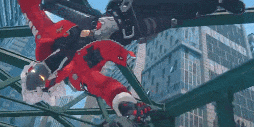 a man in a santa suit is flying through the air .