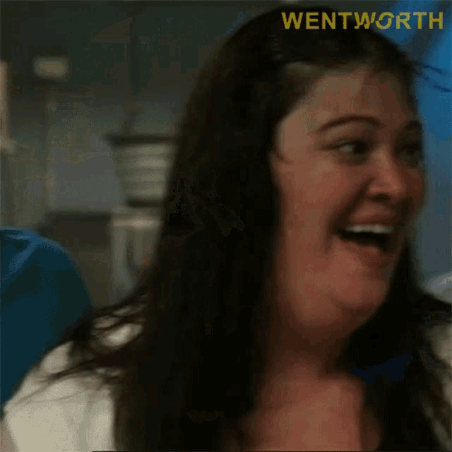 a close up of a woman 's face with the word wentworth in the corner