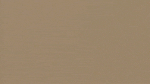 a close up of a piece of brown paper with a grainy texture .