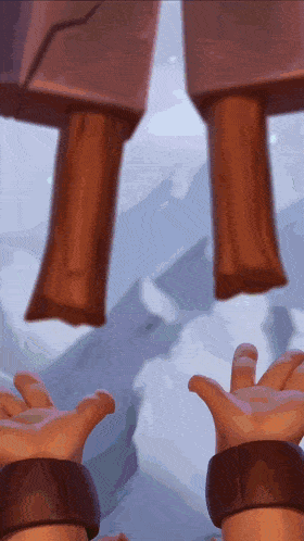 a close up of a person 's hands reaching out towards something