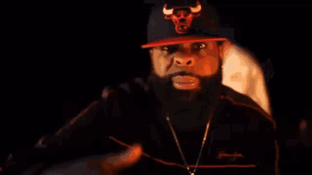 a man wearing a hat with a chicago bulls logo