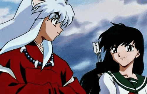 inuyasha and kagome from inuyasha are standing next to each other looking at each other .