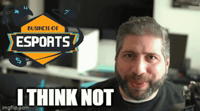 a man with a beard is standing in front of a business of esports logo