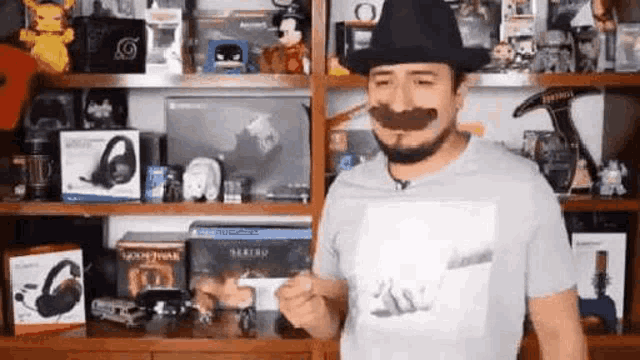 a man with a mustache and a hat is standing in front of a shelf filled with lots of toys .