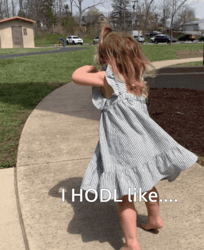 a little girl in a striped dress is walking down a sidewalk with the words " i hodl like " above her