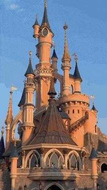 a large castle with many towers and a clock tower