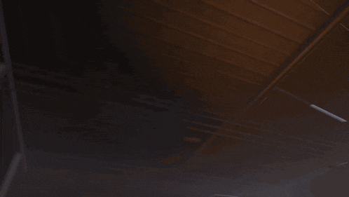 a blurred image of a robot with red lights on its eyes