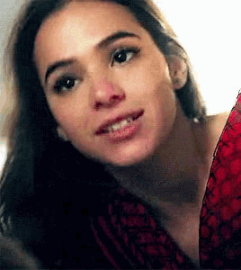 a close up of a woman 's face looking at the camera .