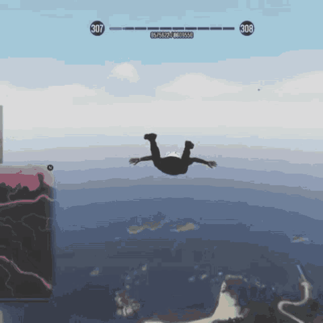 a person in a video game is flying through the air at 307 feet above the ocean