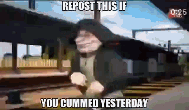 a man in a hooded jacket is standing in front of a train with a caption that says repost this if you cummed yesterday