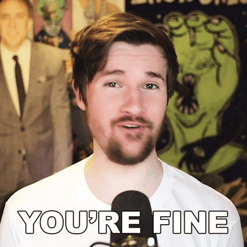 a man with a beard says you 're fine in front of a green monster