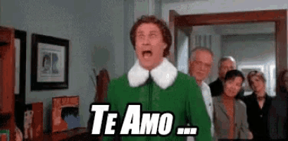 a man in a green dress is screaming and saying `` te amo '' in a living room .