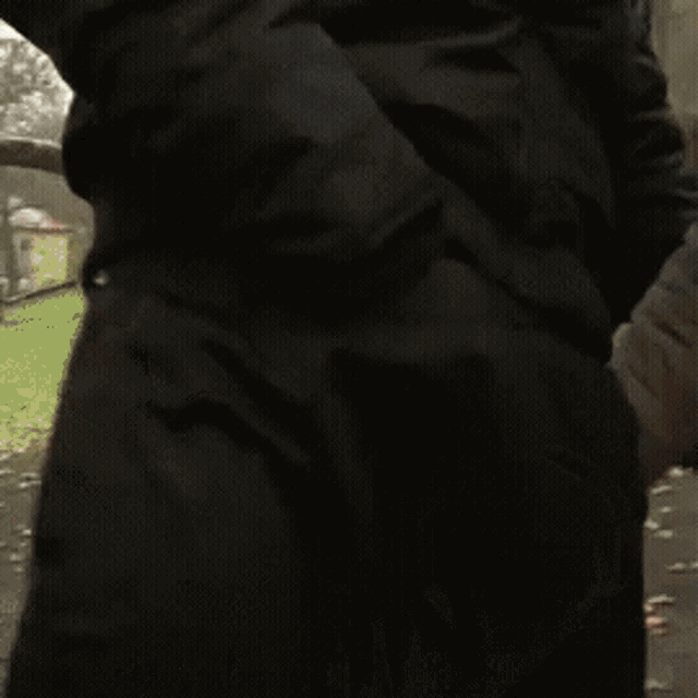 a police officer is putting his hand on a man 's shoulder .