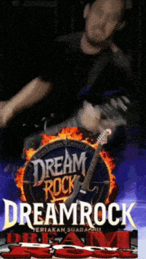 a man is playing a guitar in front of a dream rock sign